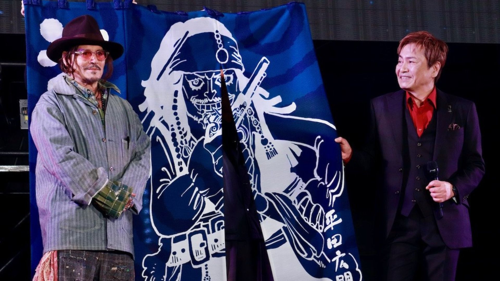 Johnny Depp receiving a gift 