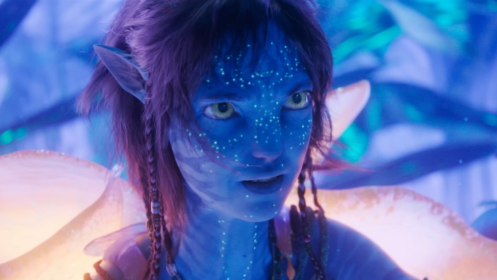 Kiri wearing the orange wings that lets her breathe in water