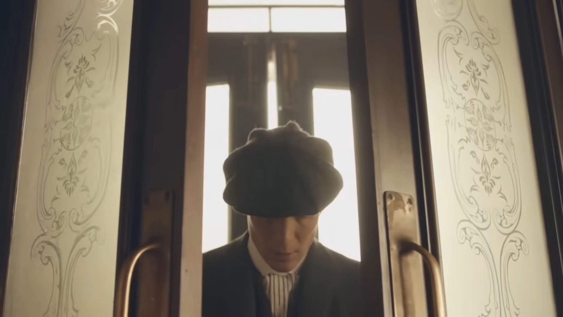 Thomas Shelby (Cillian Murphy) entering a gate in style