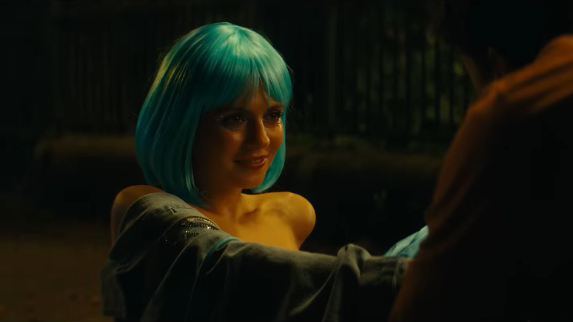 Polly watches Alex while sitting on the ground