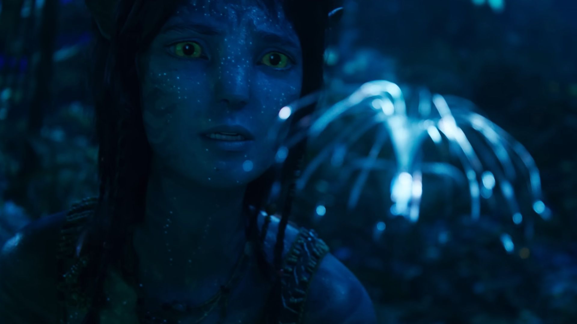 Kiri watching a glowing jellyfish-like creature in Avatar: Fire and Ash