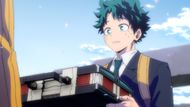 Izuku collecting the briefcase from All Might (Image Credit: Studio Bones)
