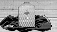 The urn sits on Sakura's jacket (Image Source: K Manga)