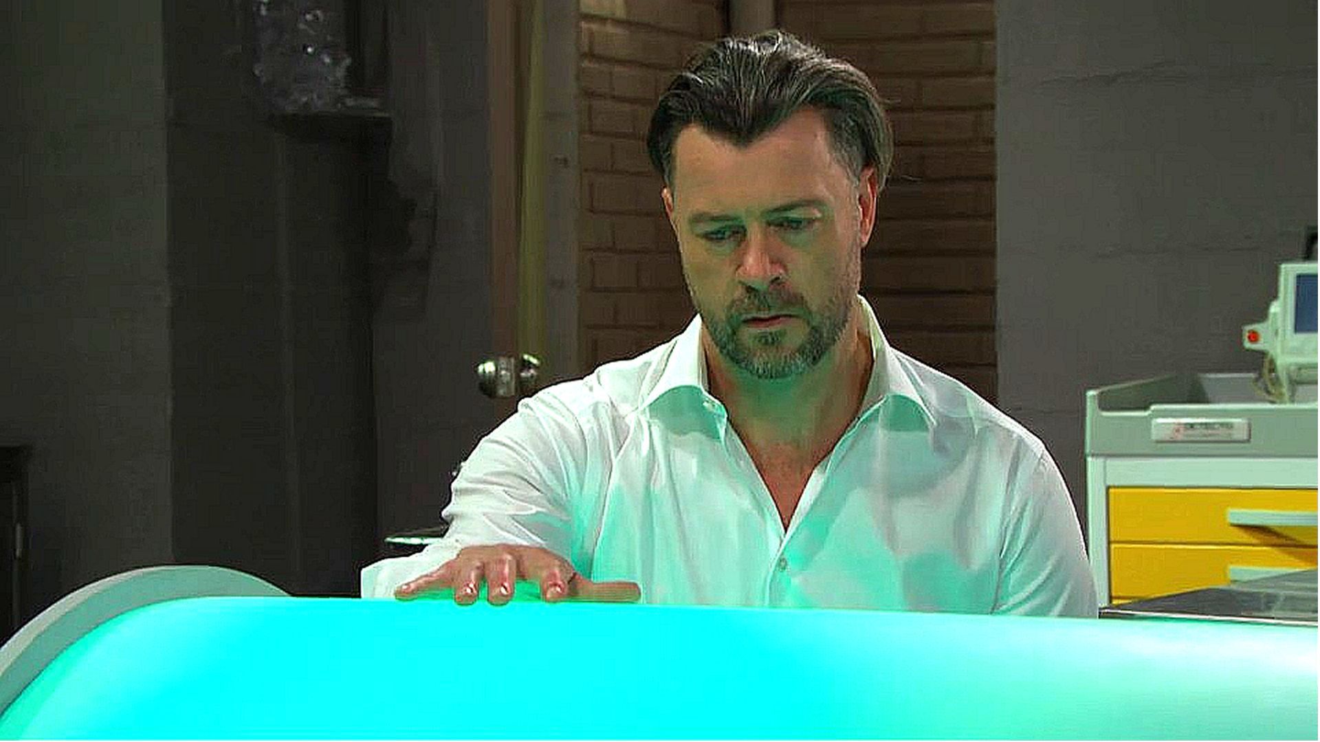 Days of our Lives' EJ looking at the hi-tech sarcophagus | Image Source: Peacock