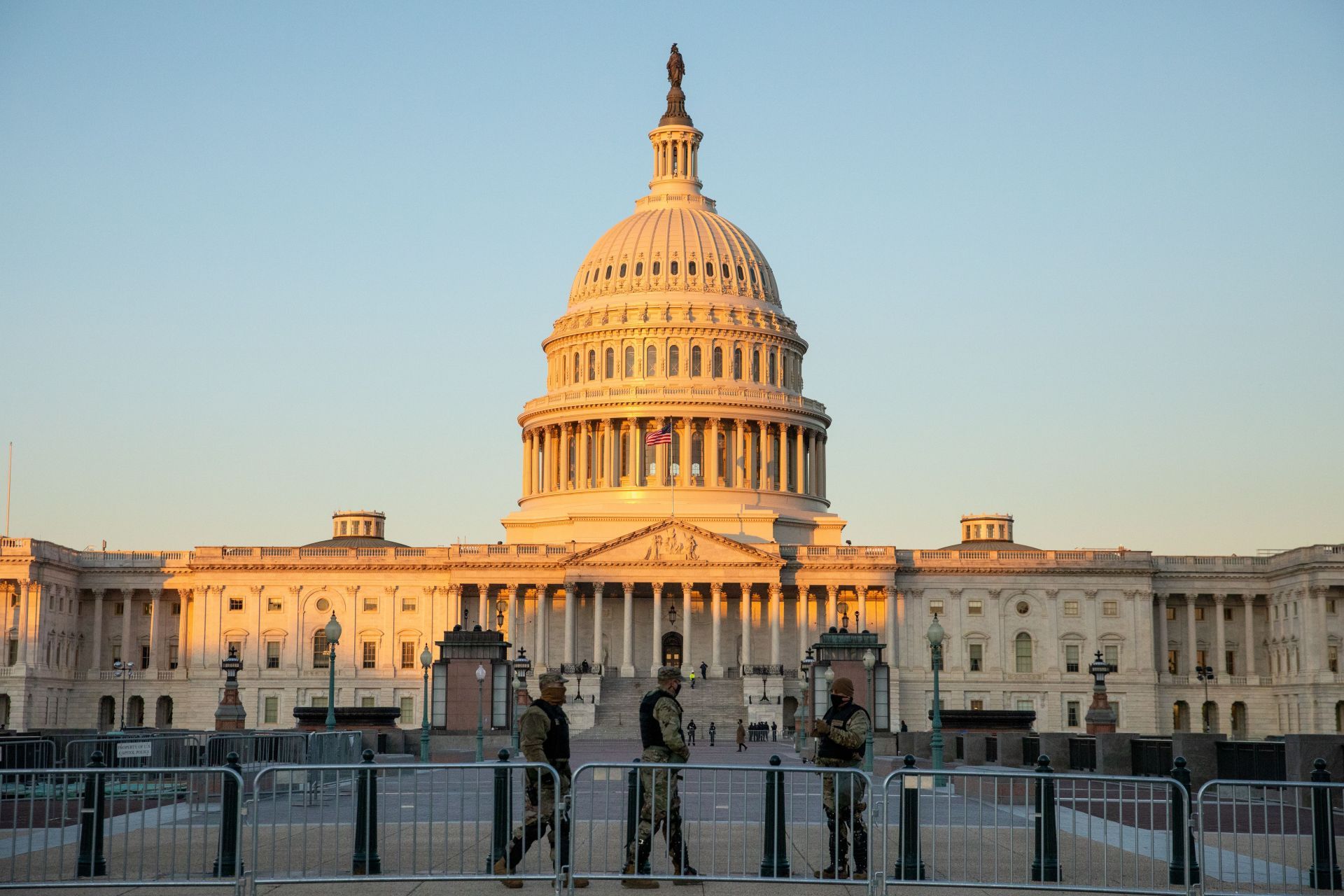WASHINGTON DC - JANUARY 7: Armed forces stand behind a barricade at the U.S. Capitol in Washington D.C. on Thursday, January 7, 2021, the day after Pro-Trump rioters infiltrated the building -Source: Getty
