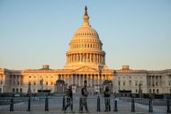 WASHINGTON DC - JANUARY 7: Armed forces stand behind a barricade at the U.S. Capitol in Washington D.C. on Thursday, January 7, 2021, the day after Pro-Trump rioters infiltrated the building -Source: Getty
