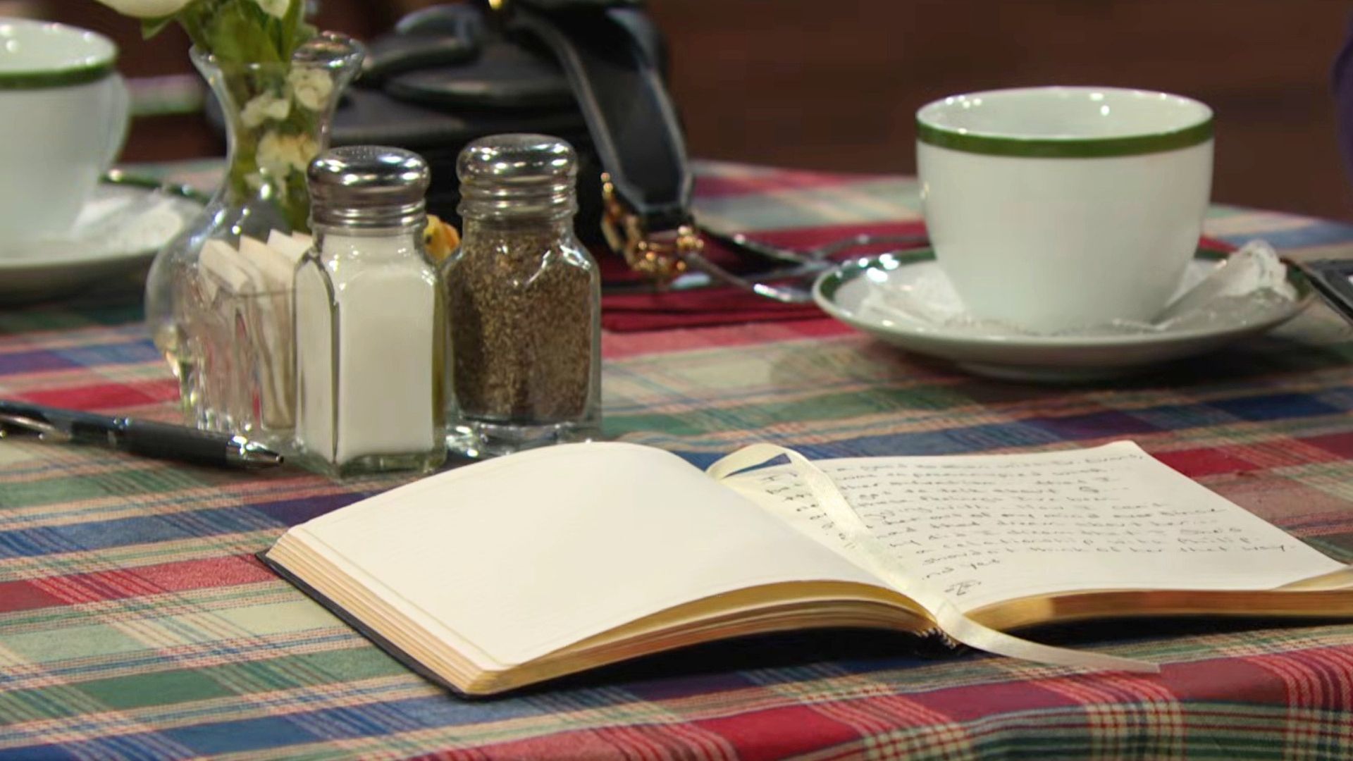 Theo's journal is left open on the table | Image: Peacock