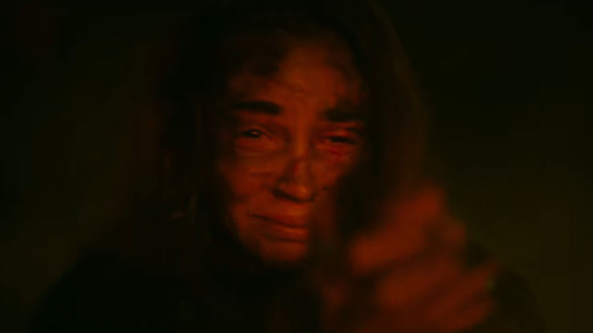 Alice holding a gun in Evil Dead Burn (Image via YouTube/@WarnerBros)