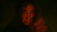 Alice holding a gun in Evil Dead Burn (Image via YouTube/@WarnerBros)