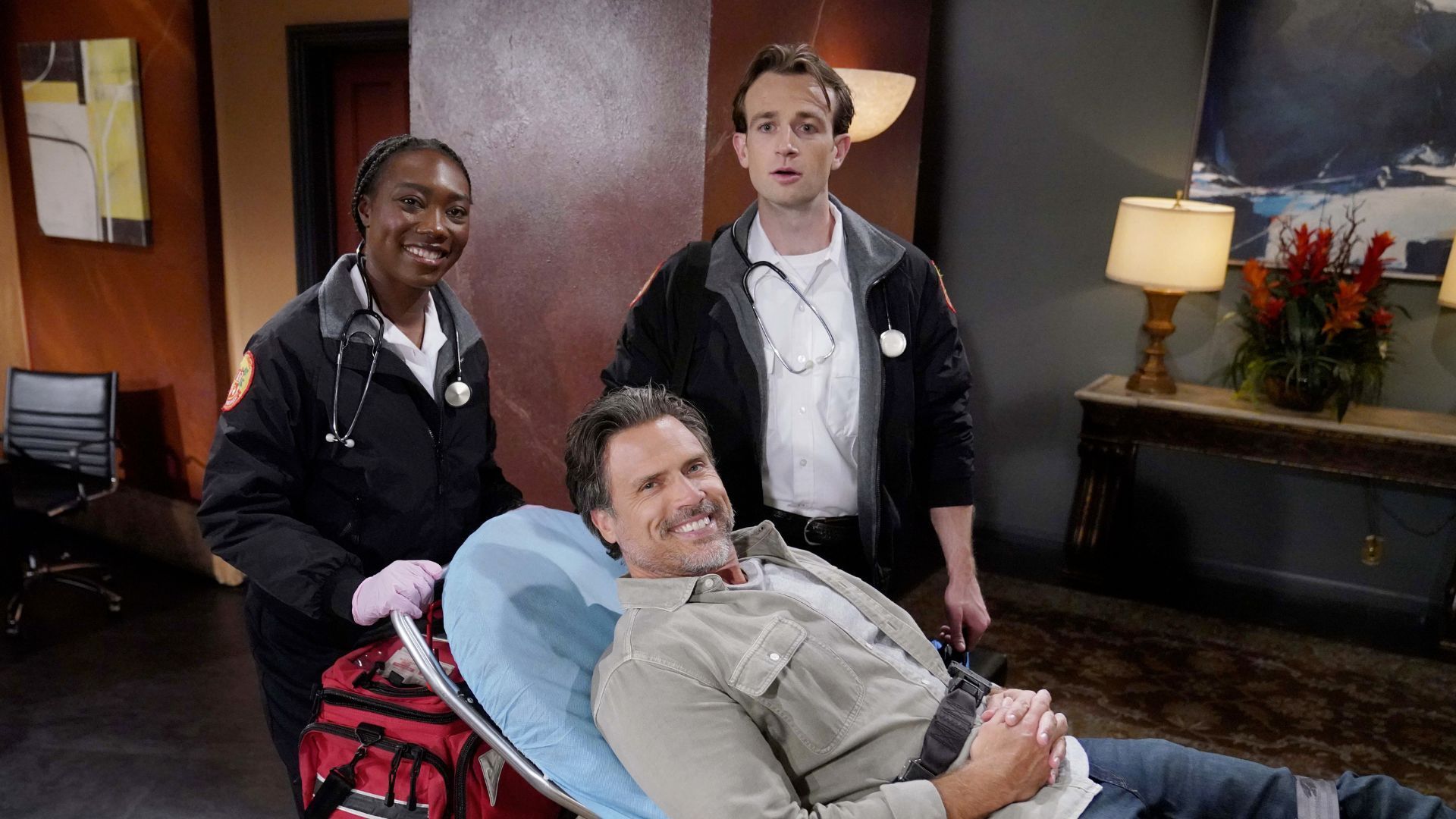 Nick (Joshua Morrow) and two help paramedics, played by Robin K. Johnson and Coby Larinde, on The Young and the Restless | Image: JPI