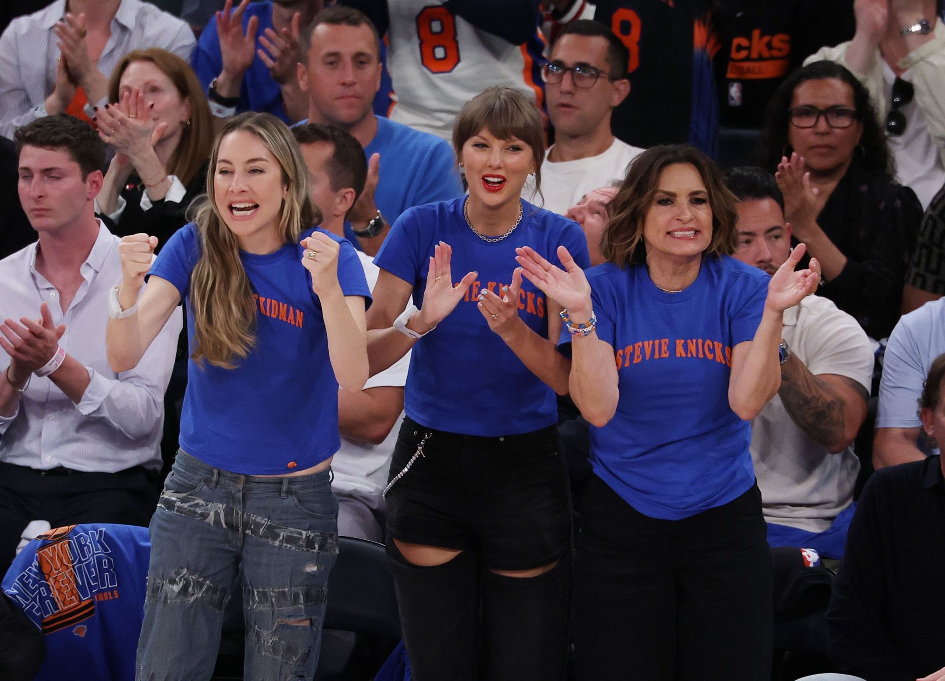 (L to R) Este Haim, Taylor Swift, and Mariska Hargitay react during 2026 NBA Finals - Game Four - Source: Getty
