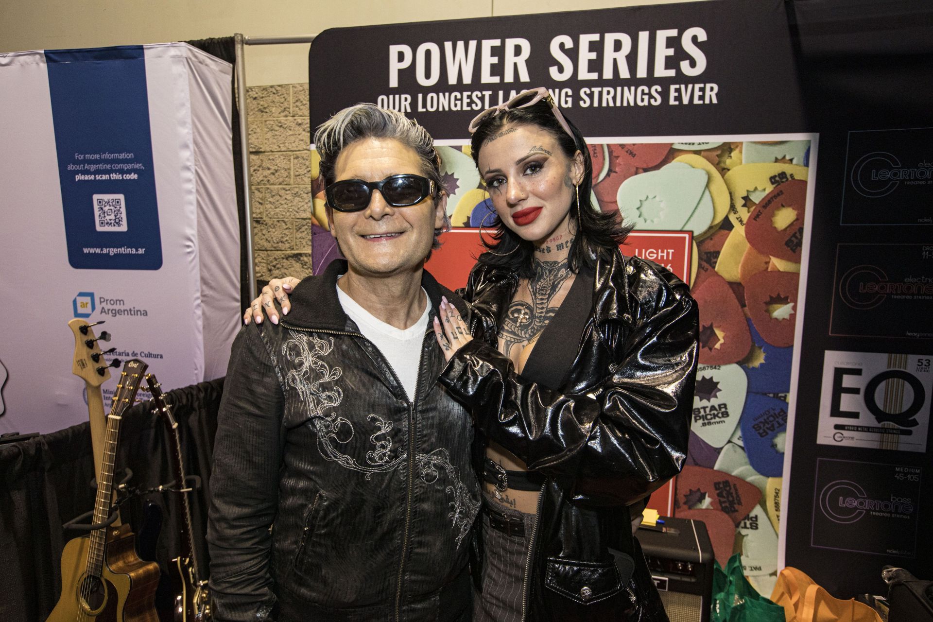 Corey Feldman (L) and Adrien Skye pose at the Cleartone Strings booth on Day 3 of 2026 NAMM Show at Anaheim Convention Center on January 24, 2026 in Anaheim, California - Source: Getty