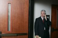 Brian Oxman, attorney for Michael Jackson, speaks on the phone just outside a courtroom at the Santa Barbara County Courthouse - Source: Getty