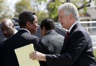 Singer Michael Jackson's brother, Jermaine Jackson (L), and attorney Brian Oxman (R) depart the Santa Barbara County Superior Court March 8, 2005 during Michael Jackson Trial - Source: Getty