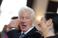Richard Gere sits alongside Reem Alabali Radovan (SPD), Federal Minister for Economic Cooperation and Development, at the event at the Hertie School to present the "Joint Initiative on Migration" - Source: Getty