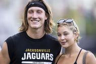Trevor Lawrence #16 of the Jacksonville Jaguars poses for a photo with his wife Marissa during Training Camp at Miller Electric Center on August 02, 2023 in Jacksonville, Florida- Source: Getty