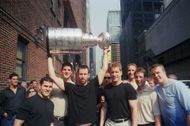 The New Jersey Devil's Hockey Team with the Stanley Cup, 1995. MVP Claude Lemieux left of the man holding the cup. They are being interviewed on the Letterman Show; 1995; New York - Source: Getty