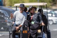 Kyle Shanahan and his wife drive away on a golf cart at AUTO: JUN 06 NASCAR Cup Series - Toyota/Save Mart 350 - Source: Getty