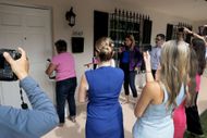 Members of the media crowd around the front door as people enter the home where Perez Hilton was found after he appeared to harm himself during a TikTok livestream - Source: Getty