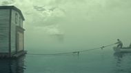 A family is pulling their house by a boat across Newfoundland waters (Image via YouTube/@Netflix)