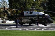 Trump waving hand while boarding Marine One - Source: Getty
